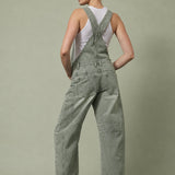 Chill Denim Overall in olive, back view showing the slouchy relaxed fit, back pockets, and full-length barrel legs.