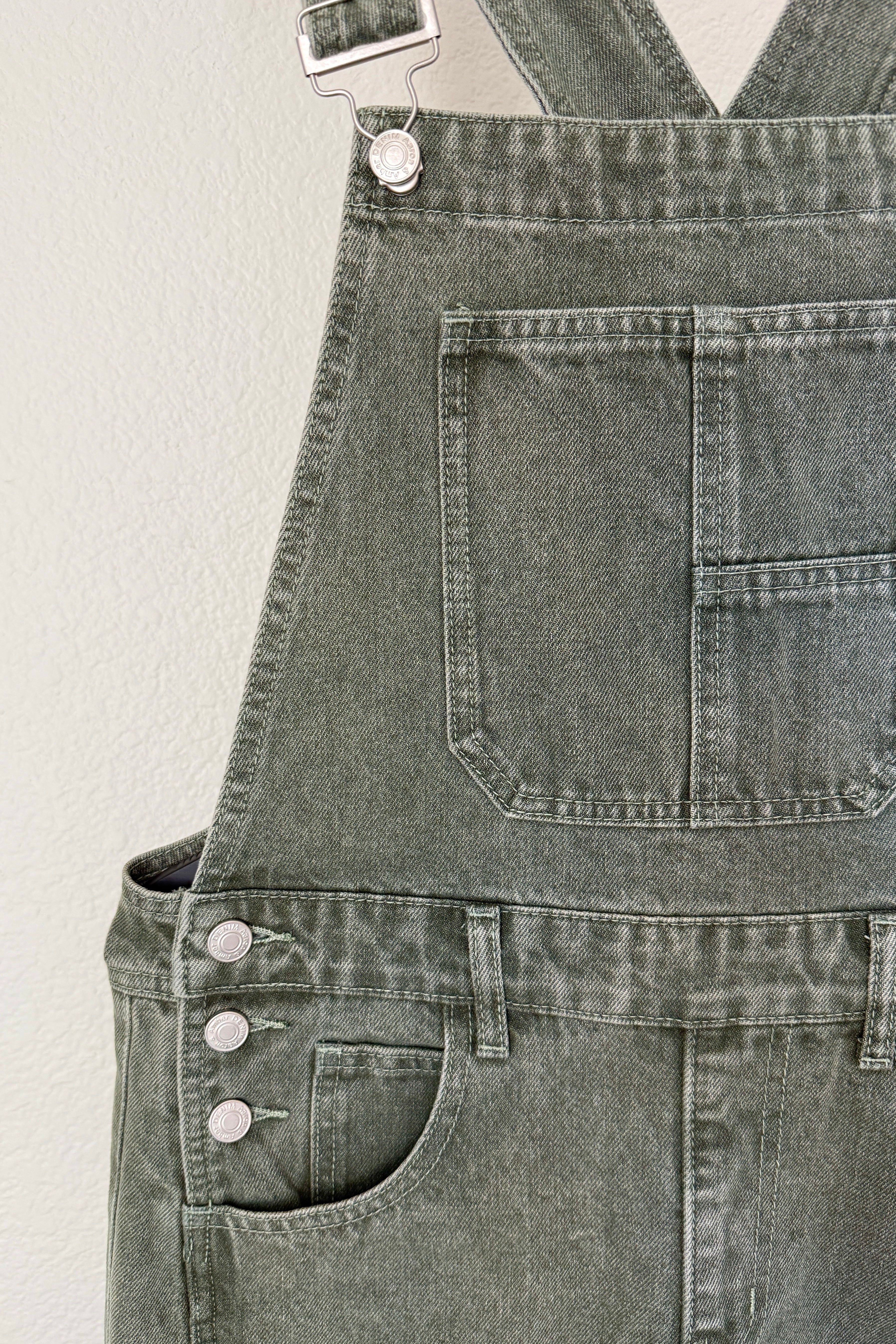 Close-up of Chill Denim Overall in olive denim - close-up front details