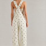 Back view of Chill Denim Overall in cream denim with black polka dots