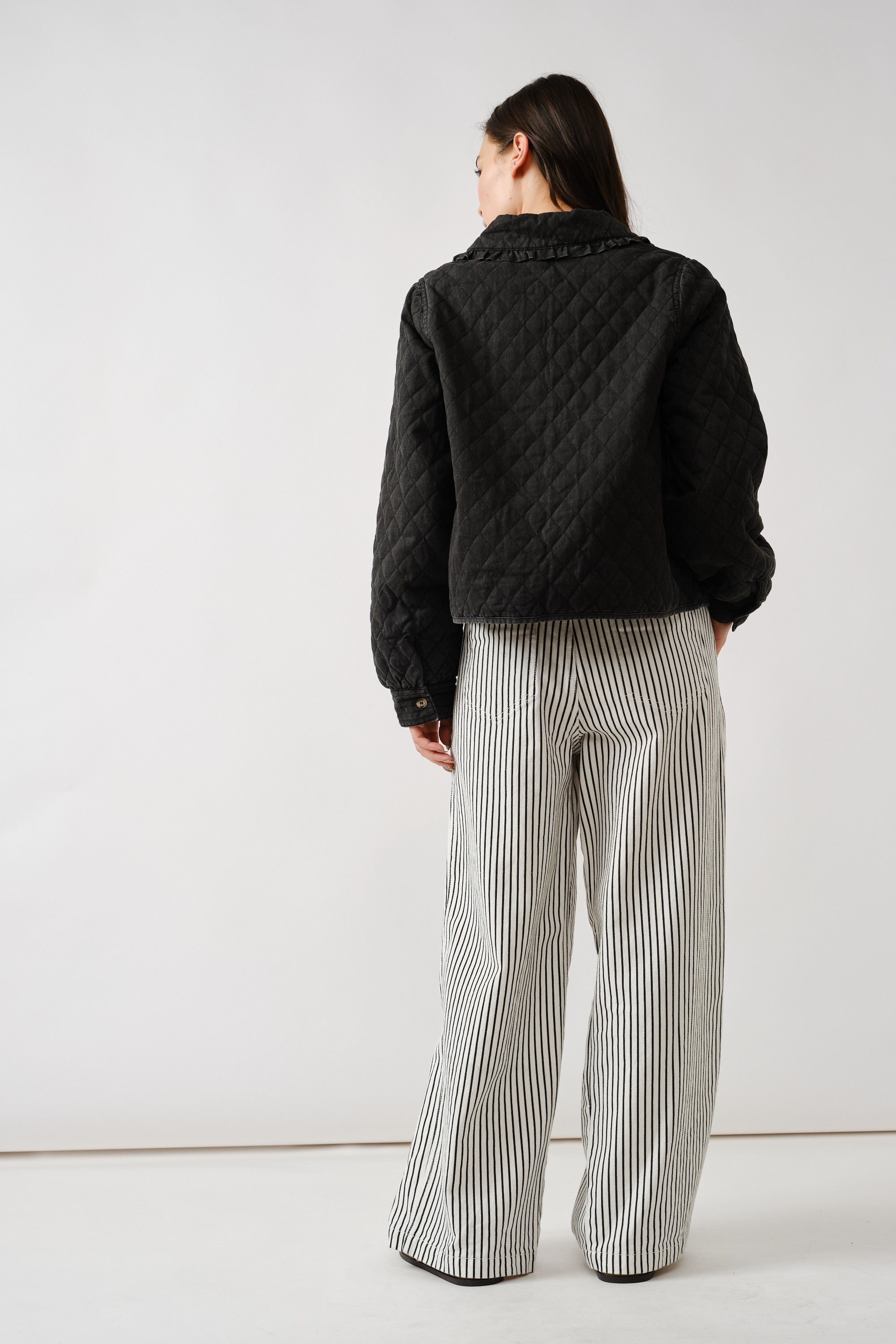 Chloe quilted denim jacket in black, back view