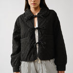 Chloe bow quilted denim jacket in black, front view