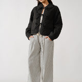 Chloe bow quilted denim jacket in black styled in a full outfit