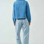 Back view of Chloe Bow Quilted Denim Jacket in denim with relaxed silhouette