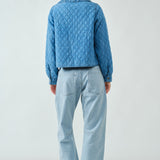 Back view of Chloe Bow Quilted Denim Jacket in denim with relaxed silhouette