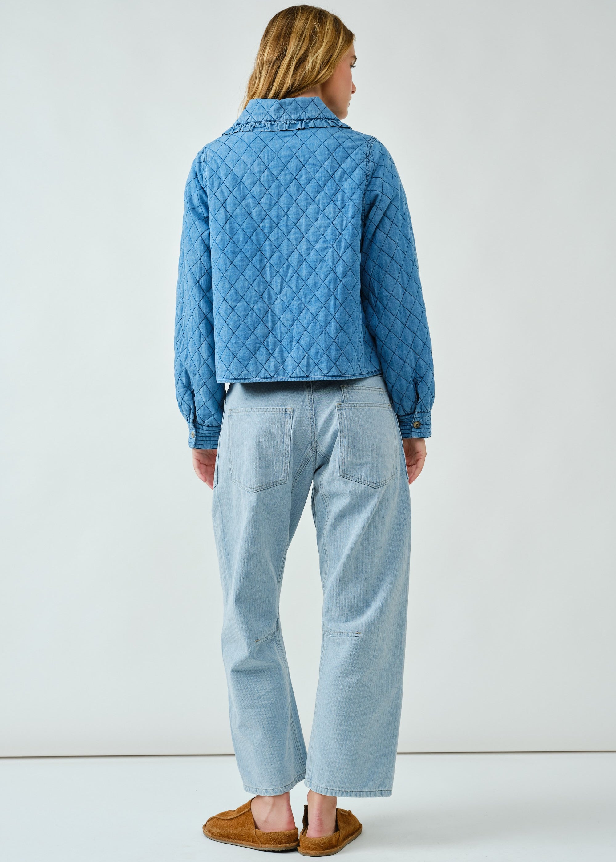 Back view of Chloe Bow Quilted Denim Jacket in denim with relaxed silhouette