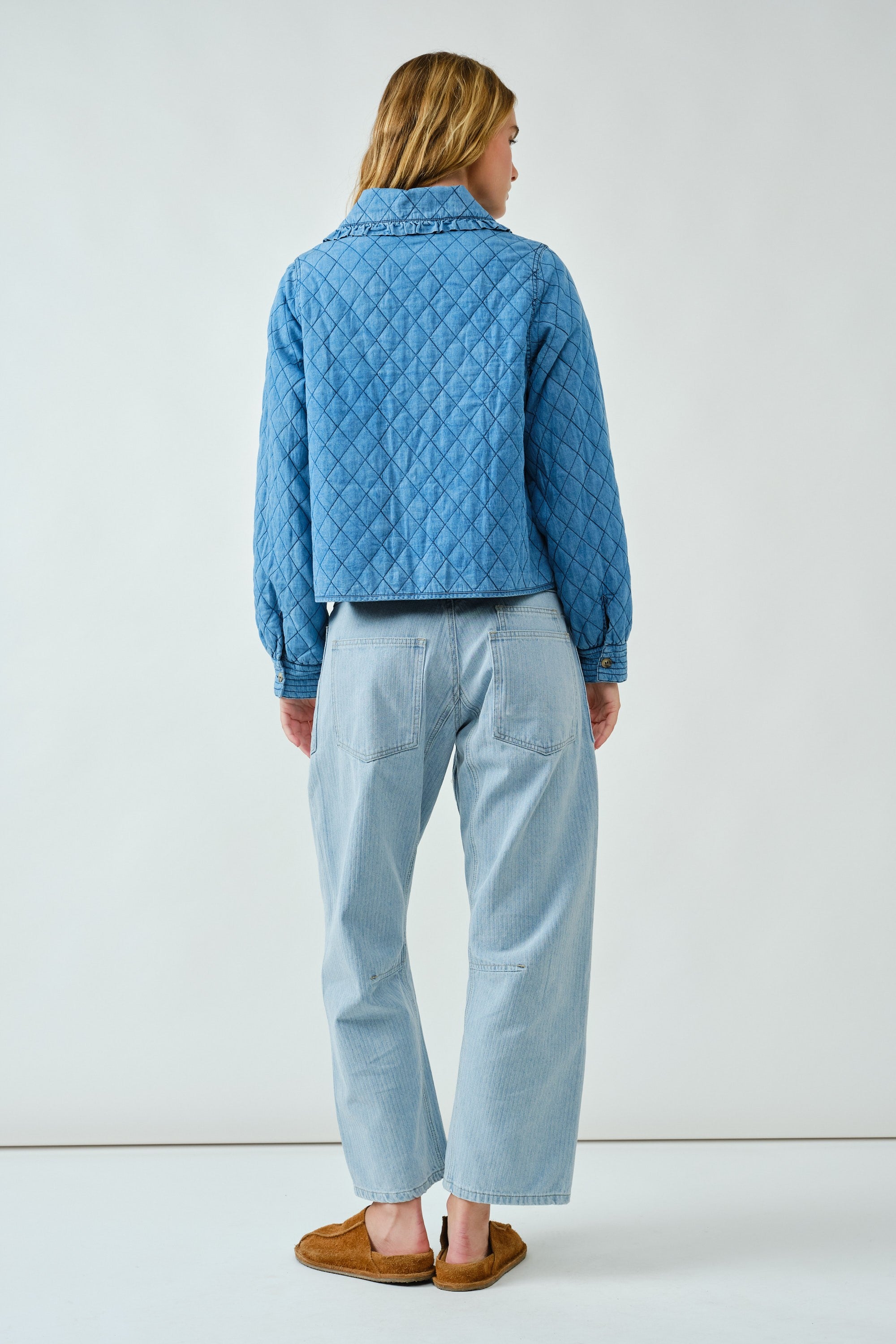 Back view of Chloe Bow Quilted Denim Jacket in denim with relaxed silhouette