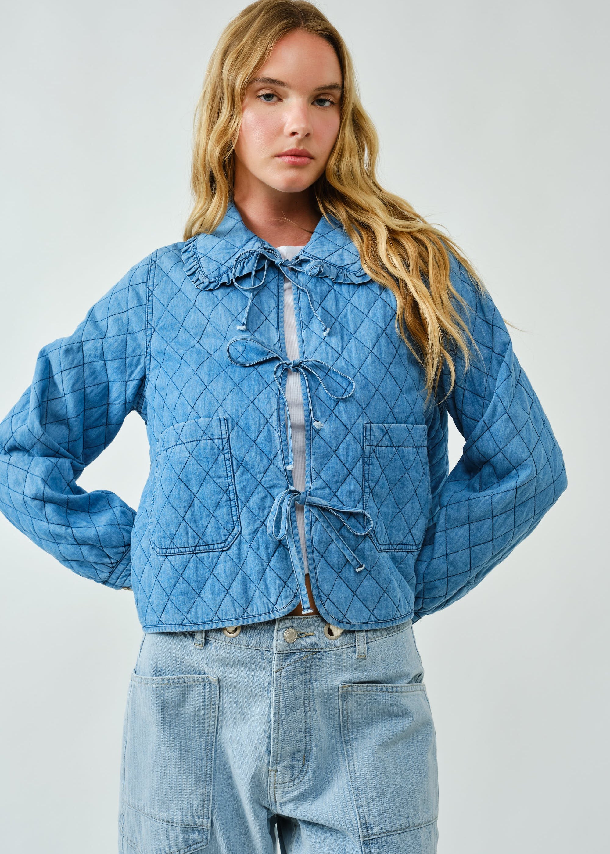 Chloe Bow Quilted Denim Jacket in denim with quilted texture, bow tie closure,