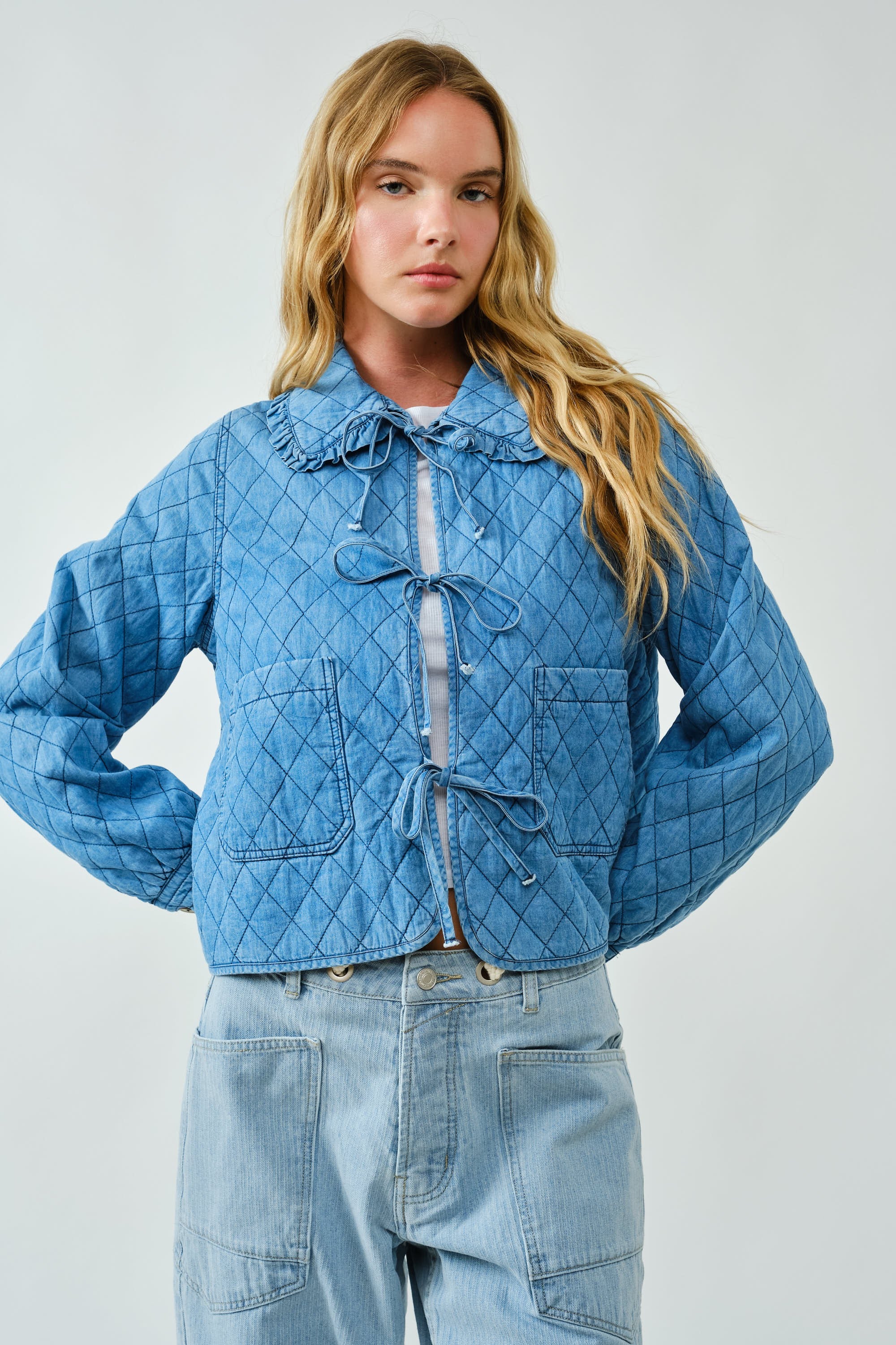 Chloe Bow Quilted Denim Jacket in denim with quilted texture, bow tie closure,