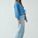 Angled view of Chloe Bow Quilted Denim Jacket styled for everyday casual wear