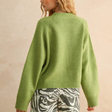 Back view of the London green city print sweater showing relaxed fit