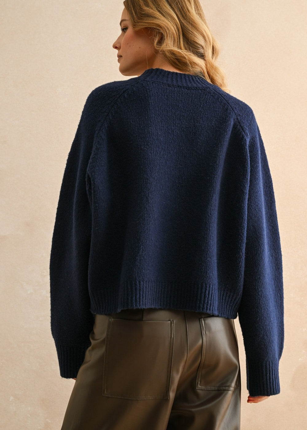 Back view of the navy city print sweater showing relaxed fit