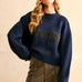 Front portrait of model wearing the City Print Casual Sweater in New York navy