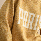 Close-up of Paris letter print on city print casual sweater in Paris butter