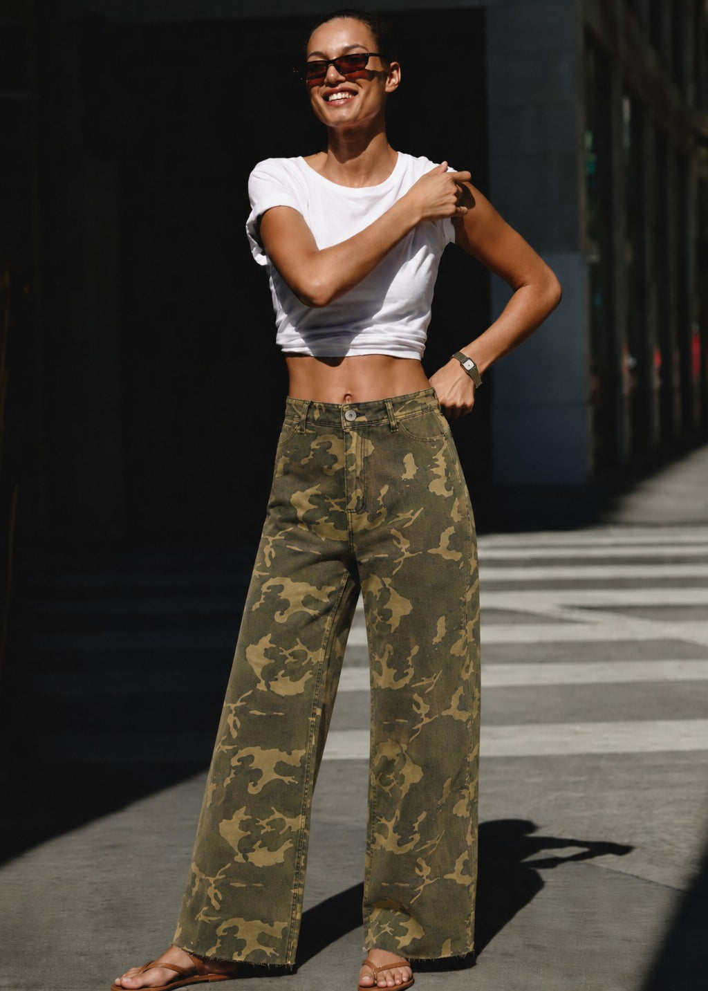 Camouflage wide leg denim pants styled with a simple top for an easy everyday outfit.