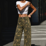 Camouflage wide leg denim pants styled with a simple top for an easy everyday outfit.