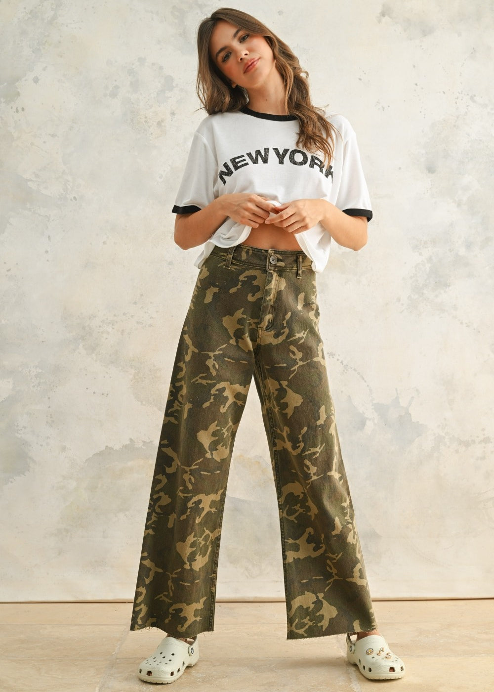 Camouflage wide leg denim pants styled with a simple top for an easy everyday outfit.