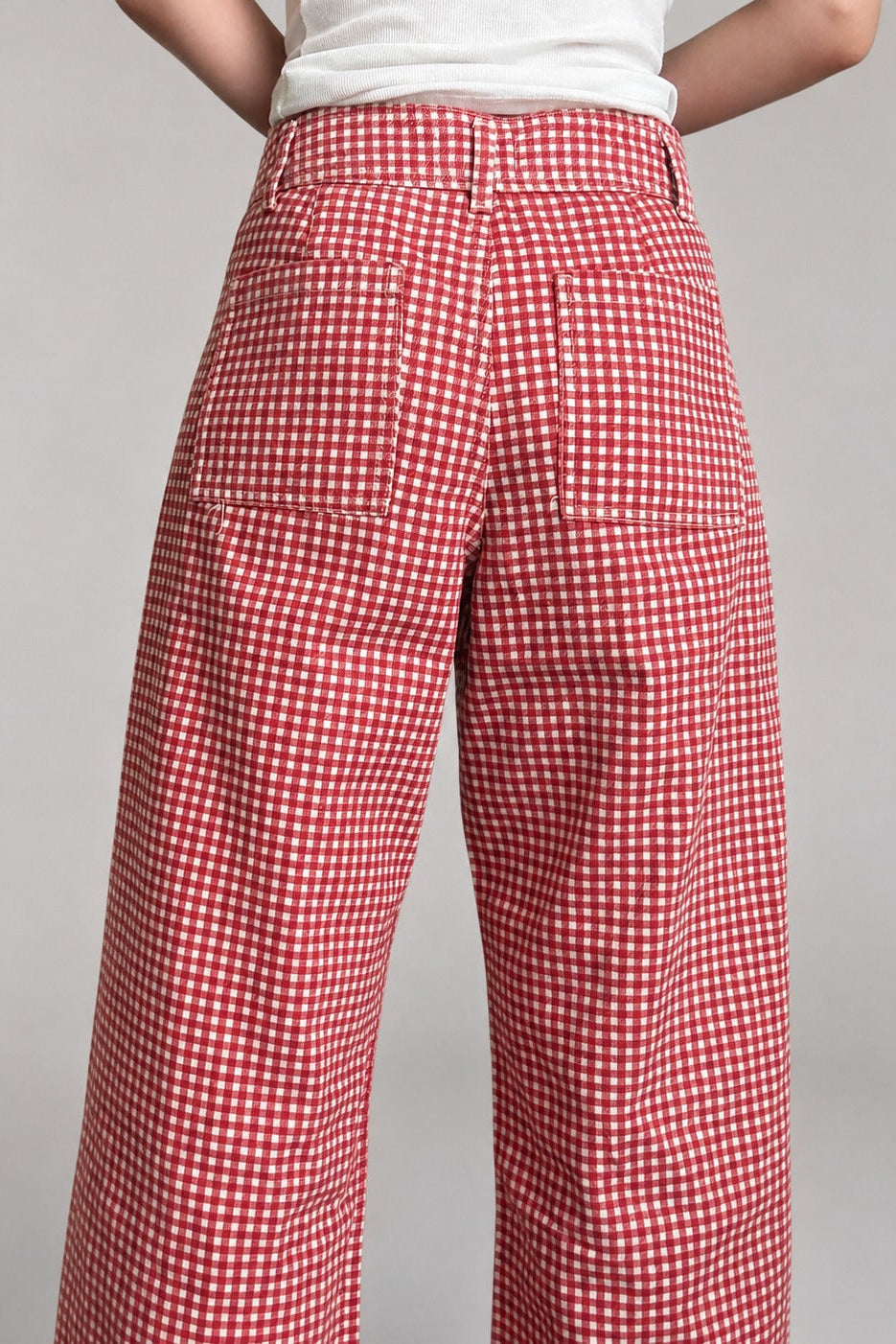 Back view of Colette wide-leg gingham pants in red showing the functional back pockets