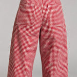 Back view of Colette wide-leg gingham pants in red showing the functional back pockets