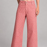 Front view of Colette wide-leg gingham pants in red with a high-rise waist and raw hem - front