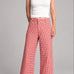 Colette red gingham wide-leg pants on model, front view