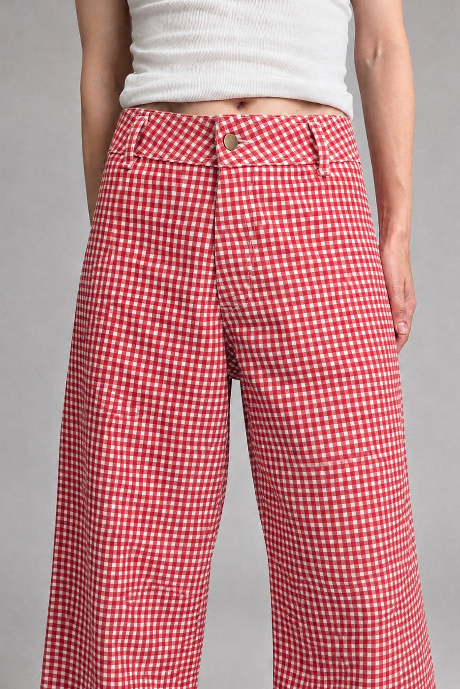 Front view of Colette wide-leg gingham pants in red with a high-rise waist and raw hem - closer