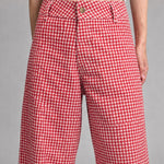 Front view of Colette wide-leg gingham pants in red with a high-rise waist and raw hem - closer