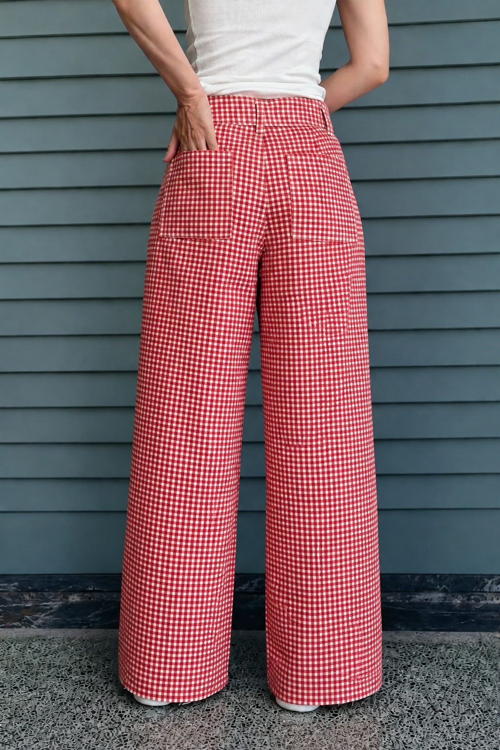 Woman wearing Colette red gingham wide-leg pants styled in a casual everyday outfit - back