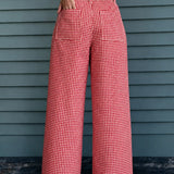 Woman wearing Colette red gingham wide-leg pants styled in a casual everyday outfit - back