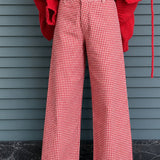Woman wearing Colette red gingham wide-leg pants styled in a casual everyday outfit - front view