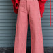 Woman wearing Colette red gingham wide-leg pants styled in a casual everyday outfit - front view