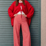 Woman wearing Colette red gingham wide-leg pants styled in a casual everyday outfit