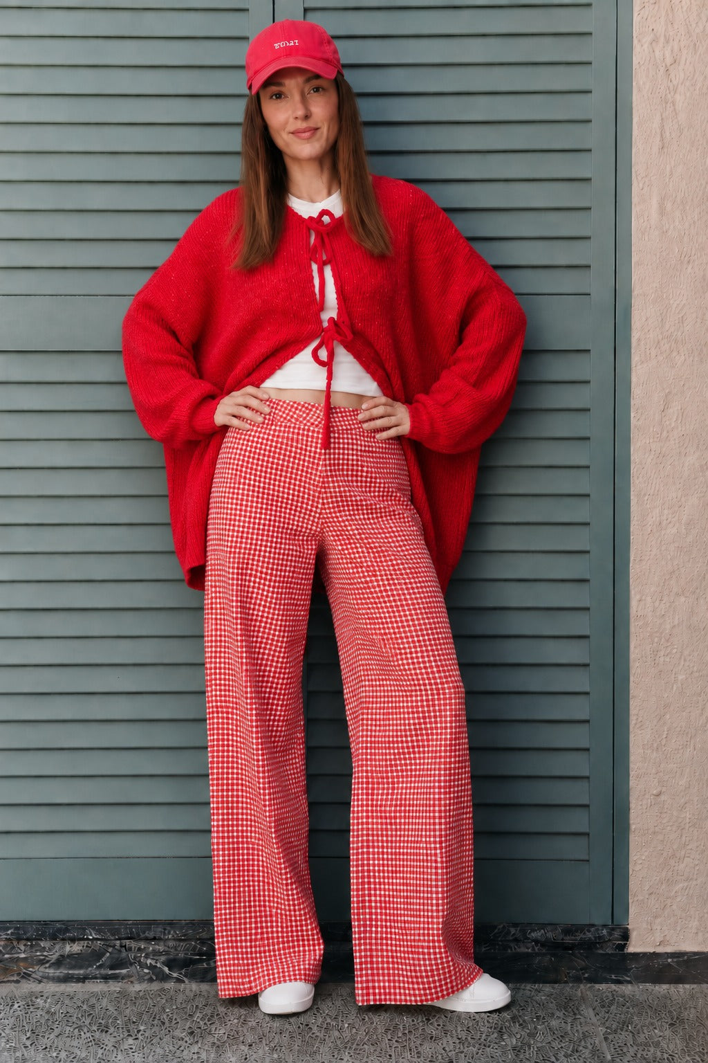 Woman wearing Colette red gingham wide-leg pants styled in a casual everyday outfit
