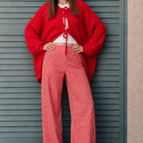Woman wearing Colette red gingham wide-leg pants styled in a casual everyday outfit