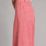 side view of Colette wide-leg gingham pants in red with a high-rise waist and raw hem - closer