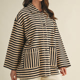 Angled front view of cozy in stripes button-up jacket with relaxed oversized silhouette