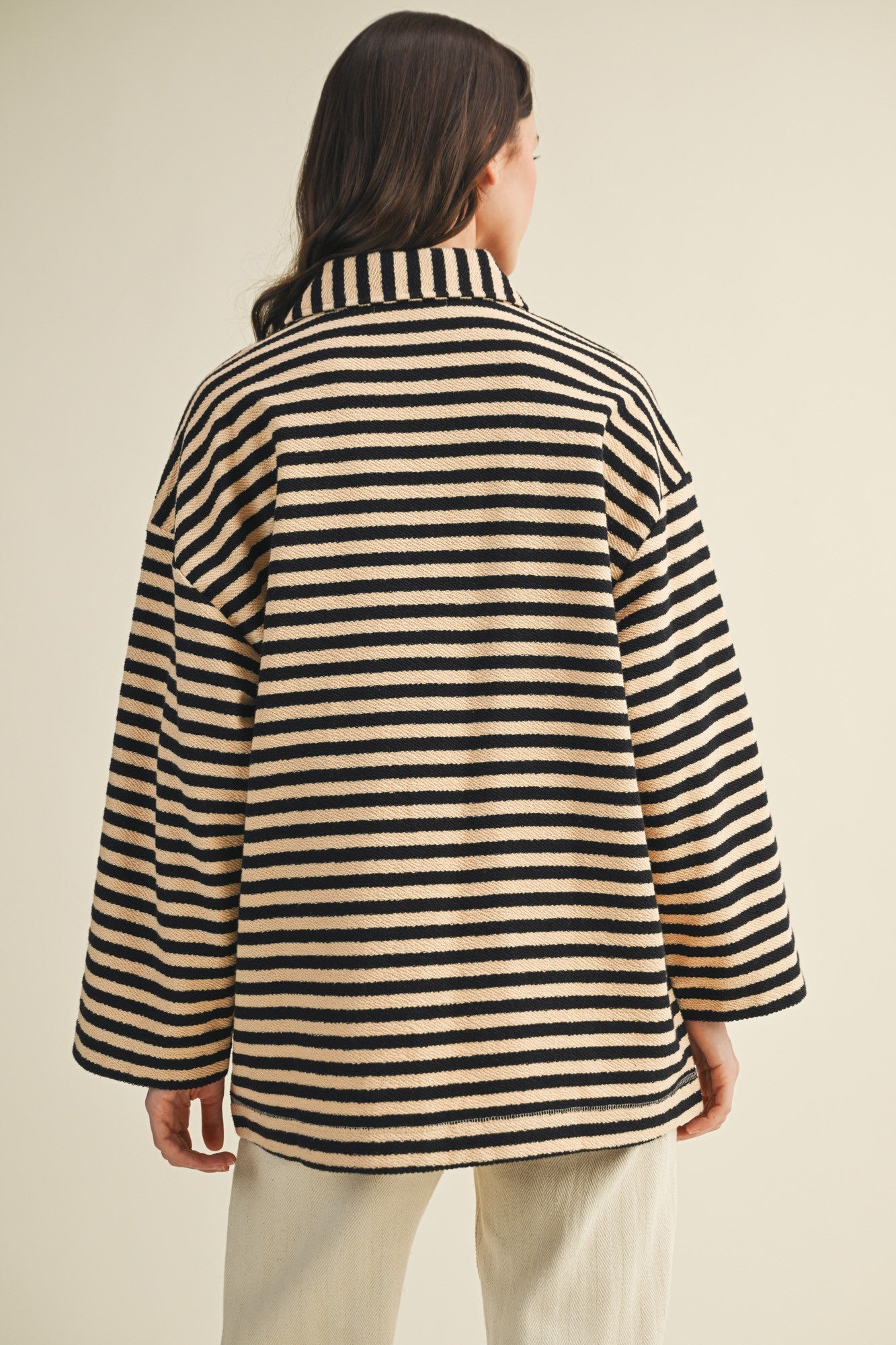 Back view of cozy in stripes button-up jacket in black combo