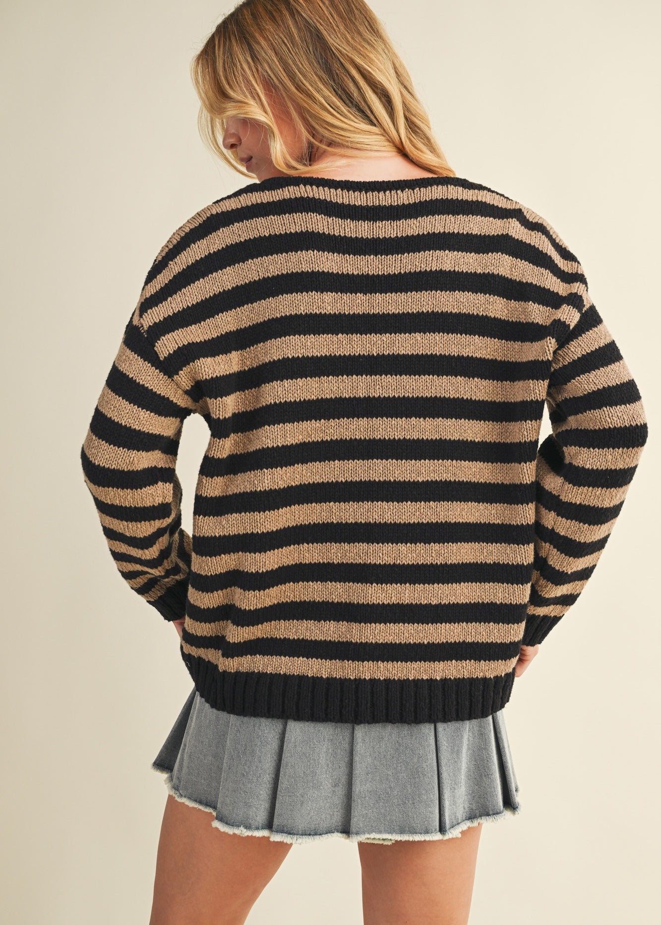 Back view of cozy stripe v neck pullover in black and mocha