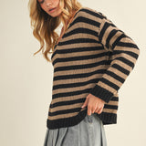 Side view of cozy stripe v neck pullover showing relaxed silhouette
