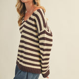Side view of cozy stripe v neck pullover showing relaxed silhouette