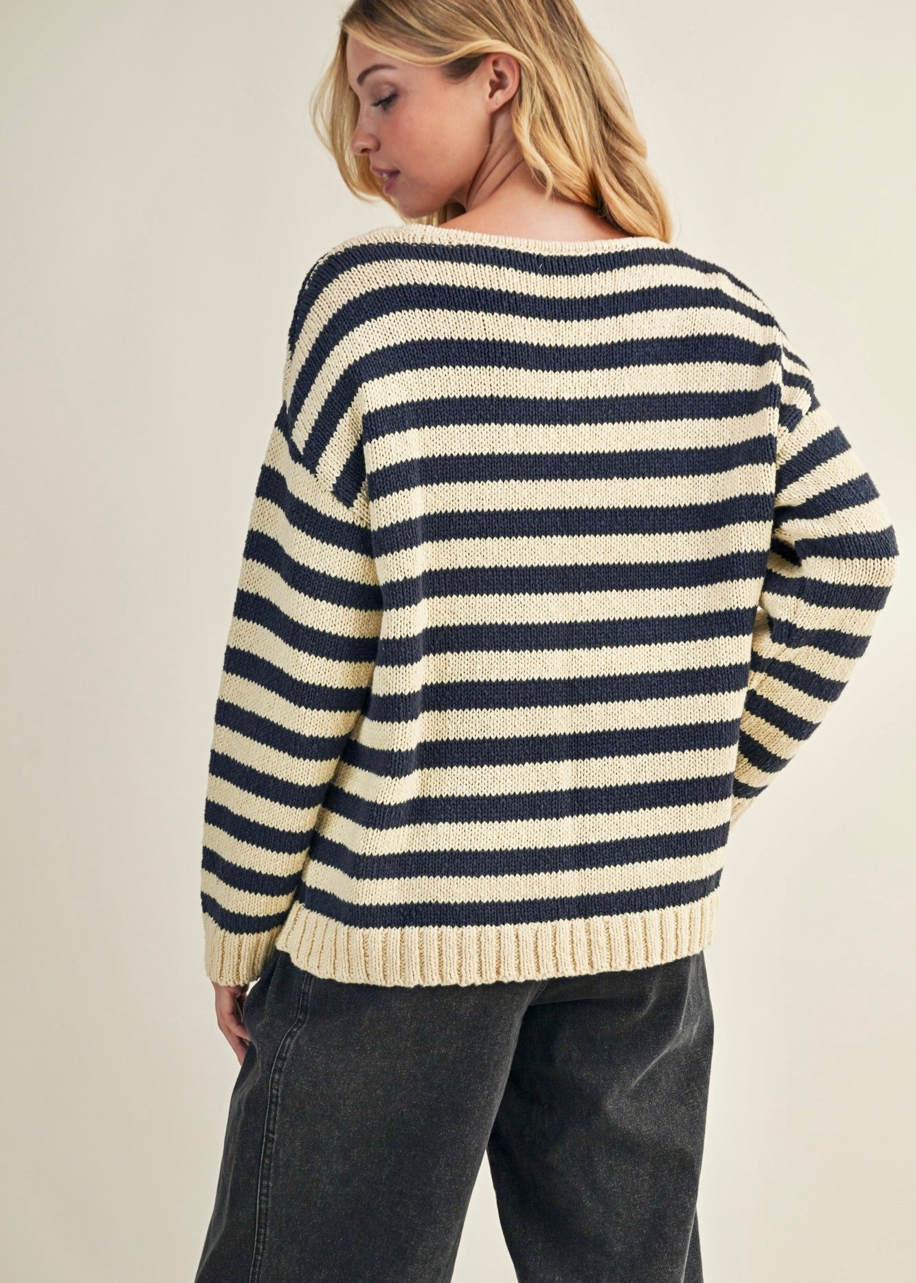 Back view of cozy stripe v neck pullover in navy and ivory
