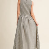 Back view of Darcy Smocked Stripe Maxi Dress in black and ivory stripe, featuring a smocked bodice, sleeveless cut, and relaxed maxi-length skirt.