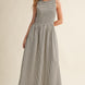 Darcy Smocked Stripe Maxi Dress in black and ivory stripe, full-length front view with sleeveless smocked bodice and side pockets.