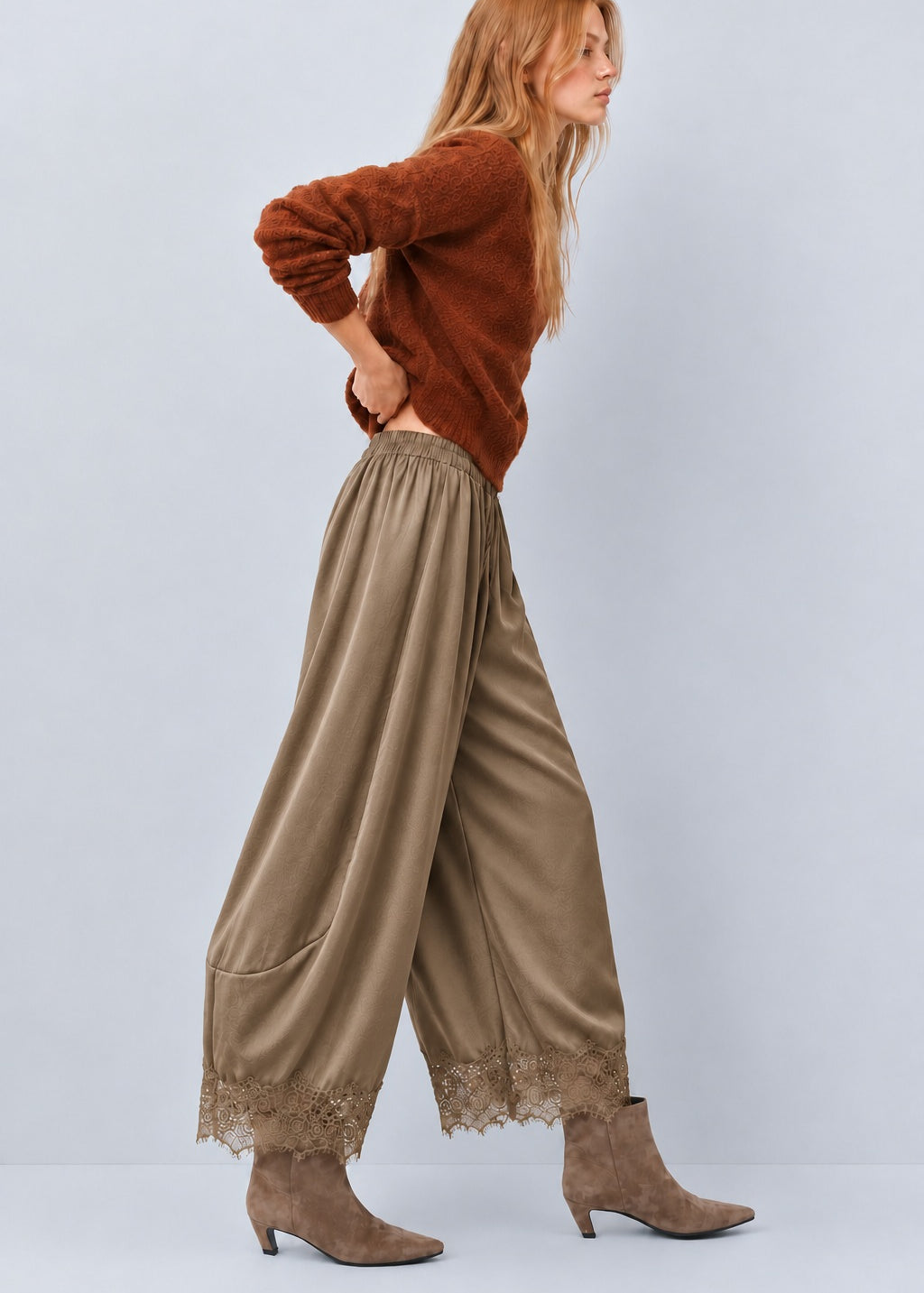 Side view of Daydream olive satin barrel pants with lace-trimmed hems