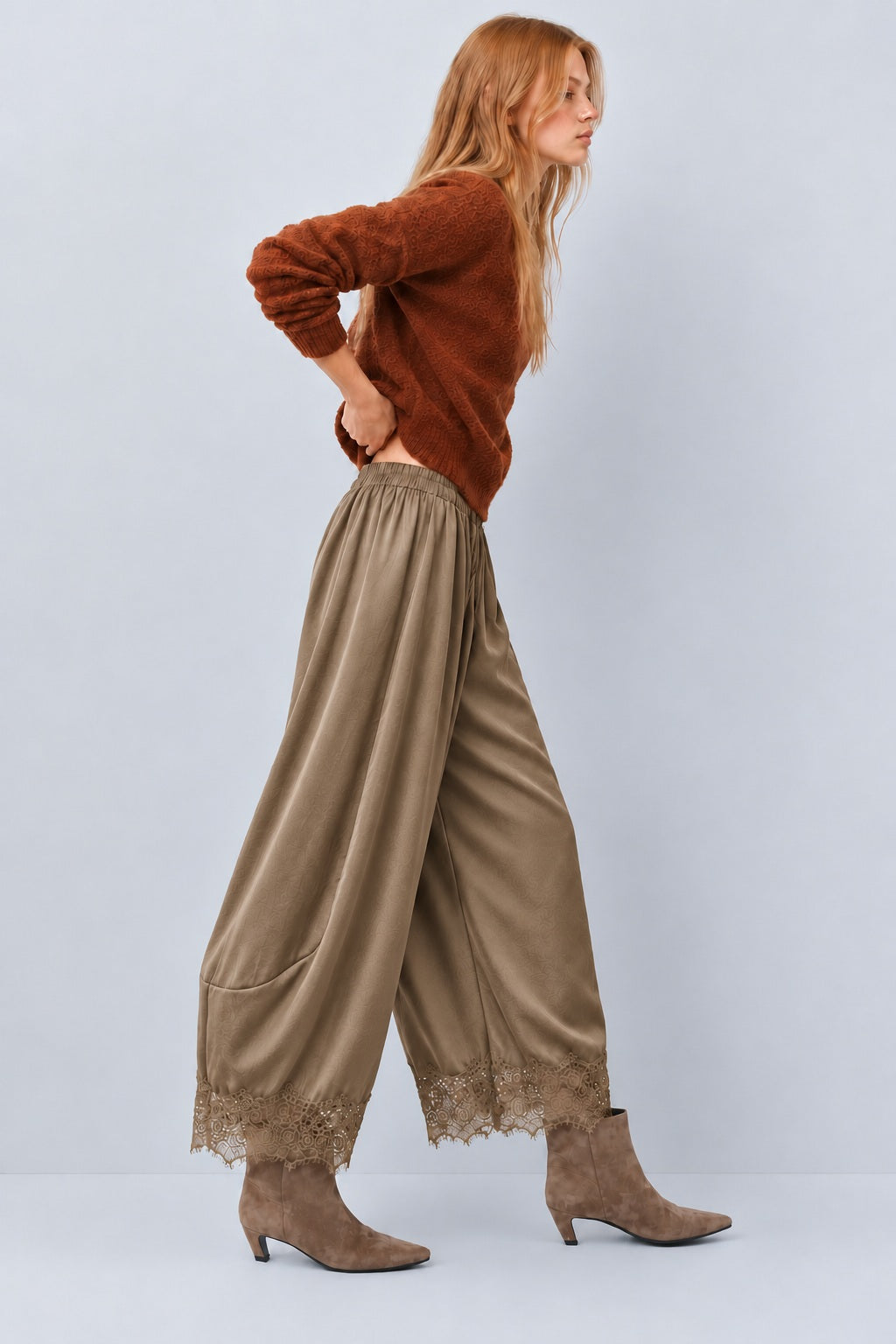 Side view of Daydream olive satin barrel pants with lace-trimmed hems