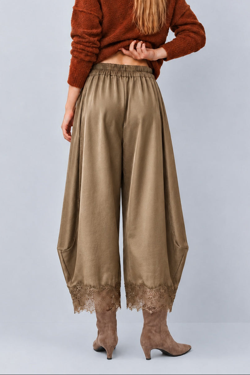 Back view of Daydream olive satin barrel pants showing the relaxed fit and lace hems