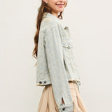 Side view of distressed hem striped denim jacket showing cropped length
