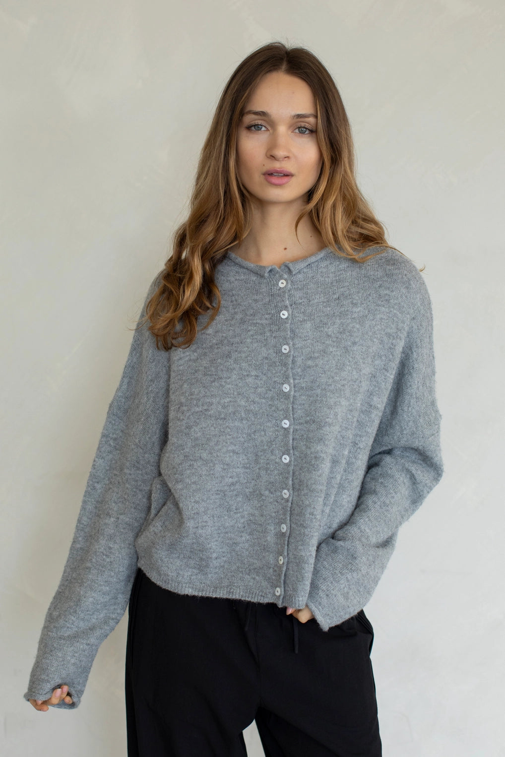model is  wearing the Hailey Button Down Cardigan (Piper Cardigan) in heather grey