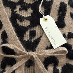 Close-up of Feline Leopard Print Tie Cardigan in mocha black showing knit texture, neckline, and tie detail