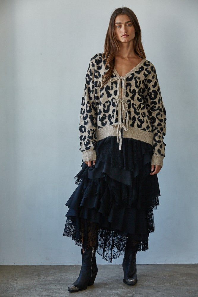Feline Leopard Print Tie Cardigan in mocha black styled with a black skirt, full body front view