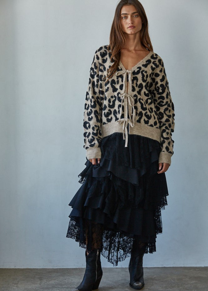 Feline Leopard Print Tie Cardigan in mocha black styled with a black skirt, full body front view